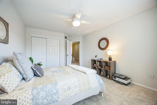 carpeted bedroom featuring ceiling fan and a closet