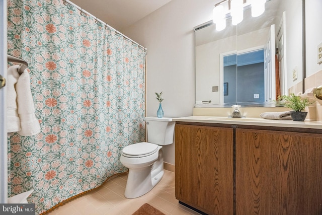 bathroom with tile patterned floors, vanity, and toilet