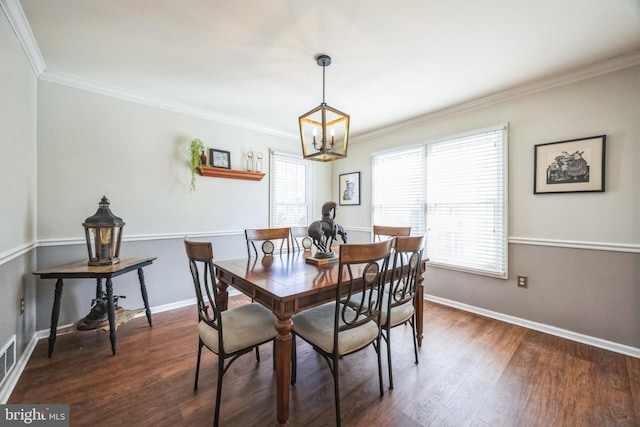 dining area featuring a healthy amount of sunlight, dark wood-type flooring, and ornamental molding