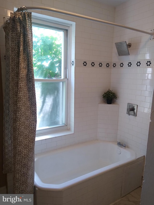 bathroom featuring shower / bath combination with curtain