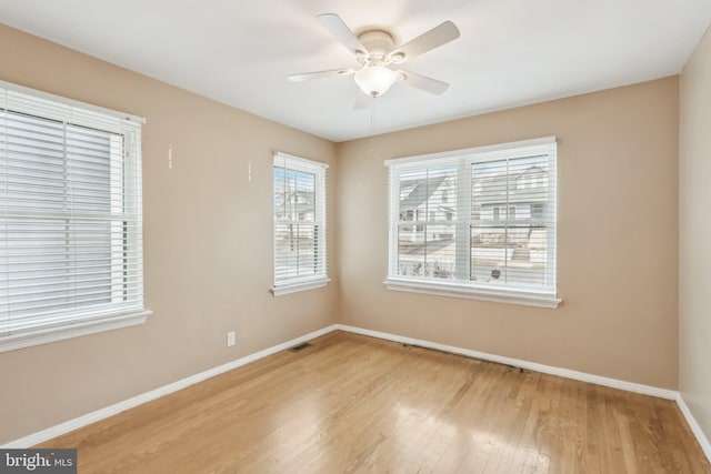 unfurnished room featuring ceiling fan and wood-type flooring