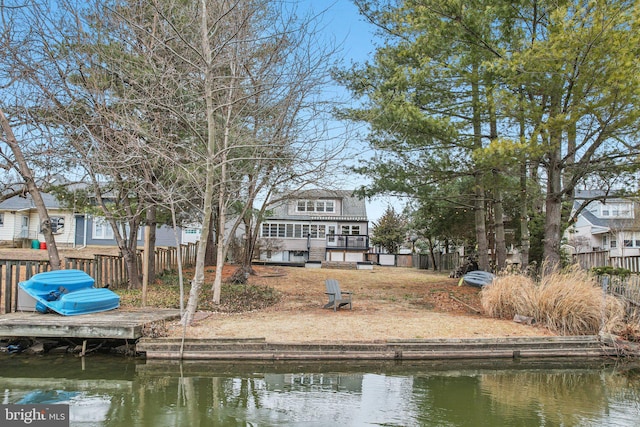 back of house featuring a water view