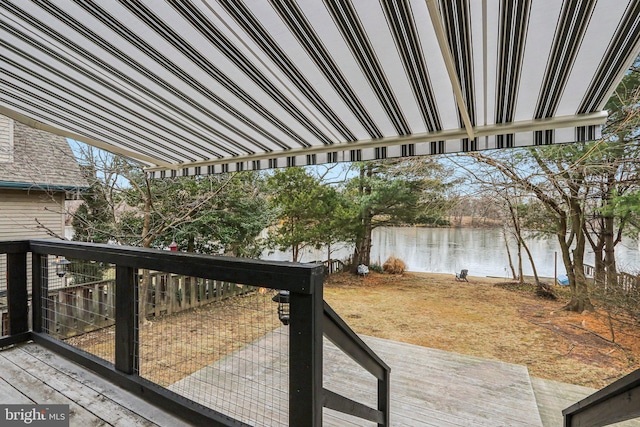 wooden terrace with a water view