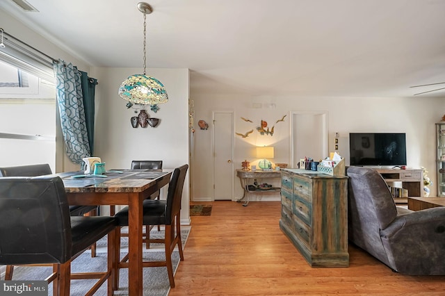 dining space featuring light hardwood / wood-style flooring