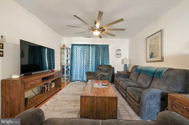 living room with ceiling fan and light hardwood / wood-style floors