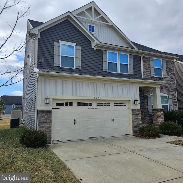 craftsman inspired home featuring stone siding, concrete driveway, board and batten siding, and a garage