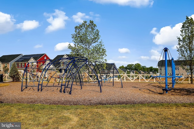 community jungle gym with a lawn