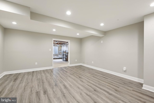 basement featuring recessed lighting, light wood-type flooring, and baseboards