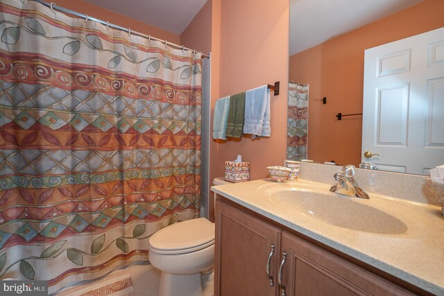 full bath featuring toilet and vanity