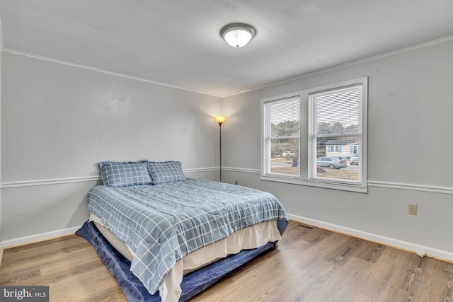 bedroom featuring hardwood / wood-style flooring