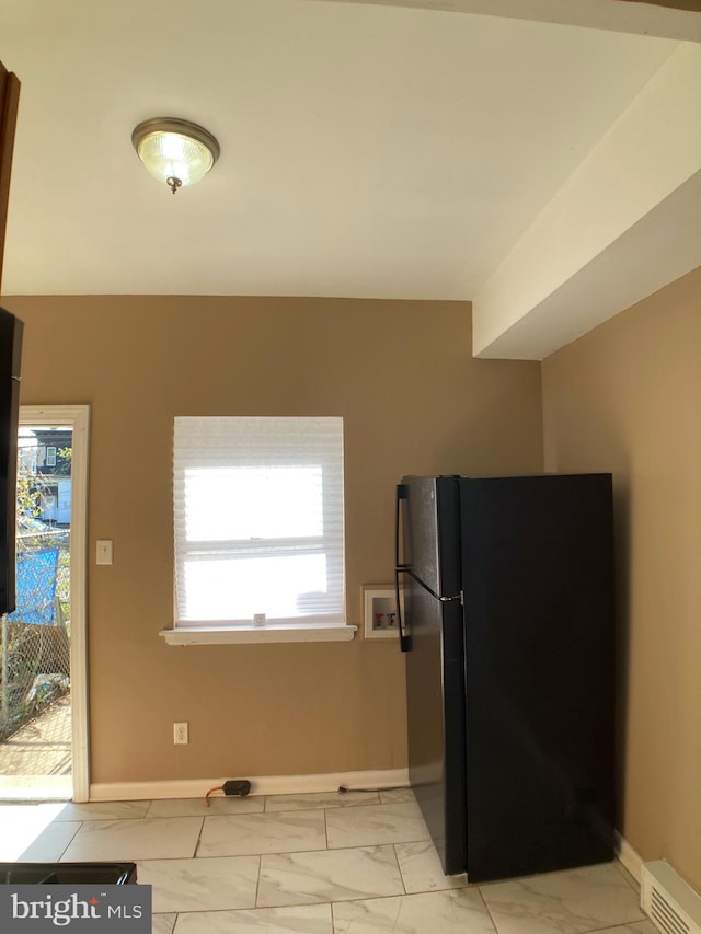 kitchen with black fridge