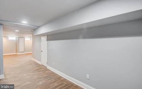 basement featuring light hardwood / wood-style flooring