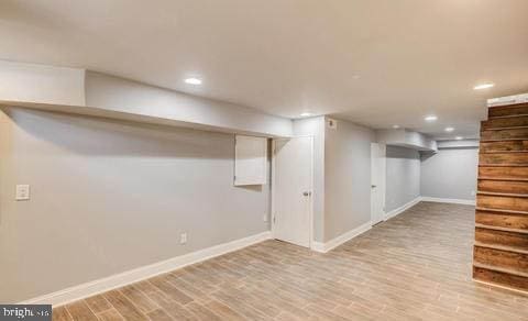 basement with light hardwood / wood-style floors