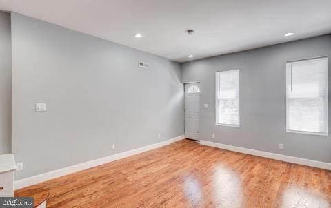 unfurnished room featuring hardwood / wood-style floors