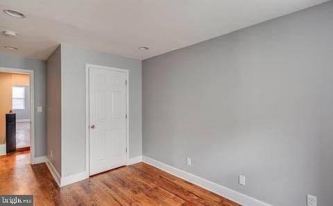 unfurnished bedroom featuring wood-type flooring