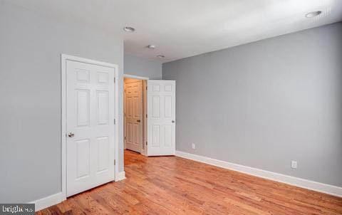 spare room featuring light hardwood / wood-style floors