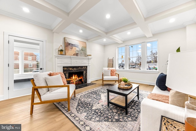 living room featuring a premium fireplace, coffered ceiling, beam ceiling, and light hardwood / wood-style floors