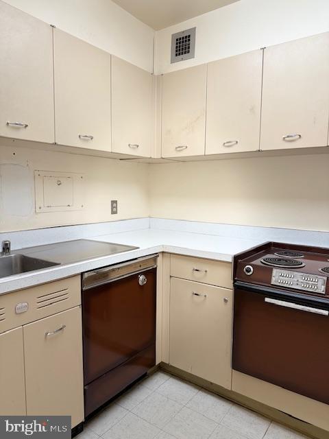 kitchen with range with electric cooktop and black dishwasher