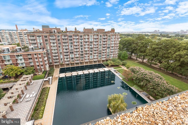 view of pool featuring a water view