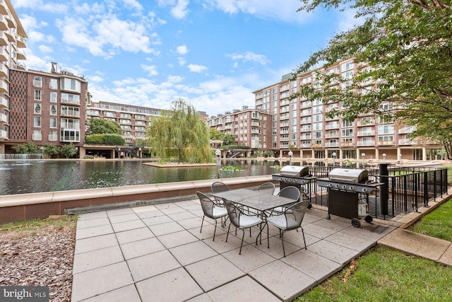 view of patio / terrace featuring a water view and area for grilling