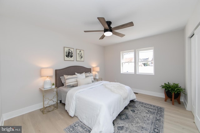 bedroom featuring ceiling fan and light hardwood / wood-style flooring