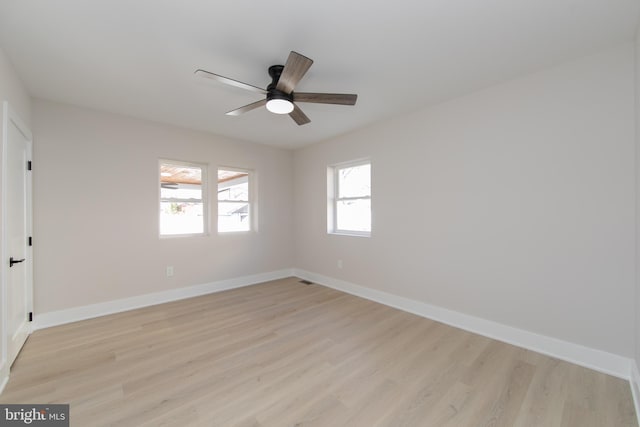 empty room featuring ceiling fan and light wood-type flooring