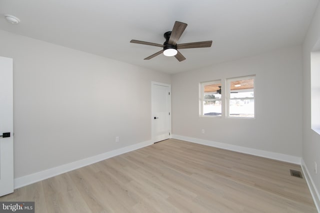 empty room with light hardwood / wood-style floors and ceiling fan