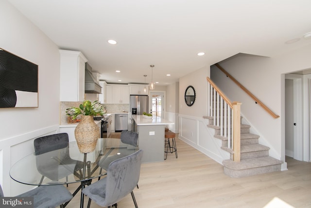 dining space featuring light hardwood / wood-style flooring