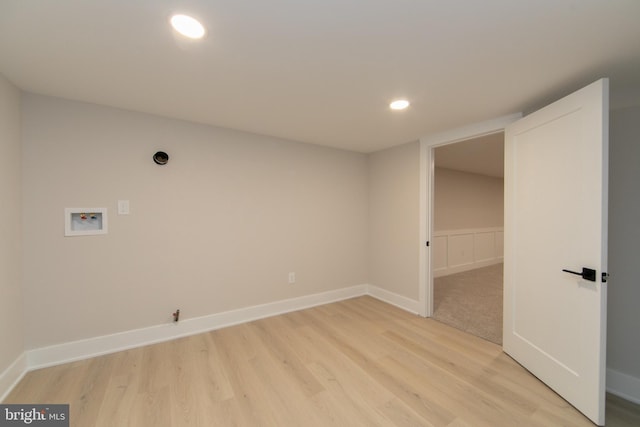 laundry area featuring hookup for a gas dryer, washer hookup, and light hardwood / wood-style floors