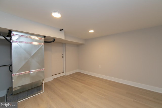 basement featuring wood-type flooring