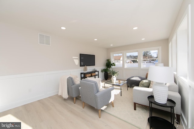 living room with light hardwood / wood-style floors