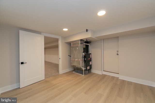 basement featuring light wood-type flooring