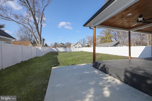 view of yard with a patio area and ceiling fan