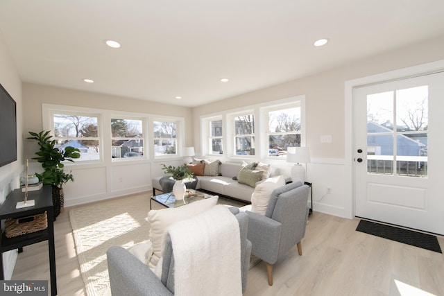 living room featuring light hardwood / wood-style flooring and a wealth of natural light