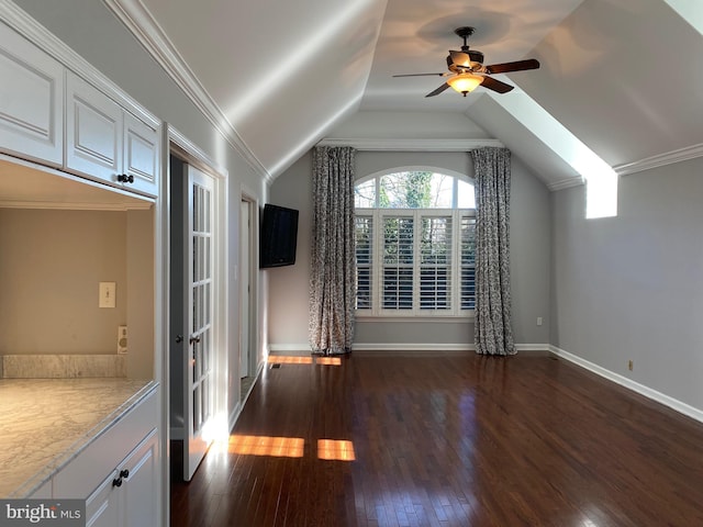 bonus room featuring dark wood-type flooring, ceiling fan, and vaulted ceiling