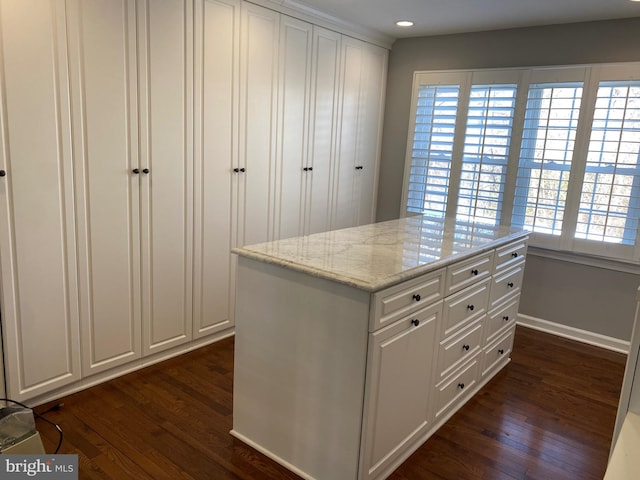 spacious closet featuring dark hardwood / wood-style flooring