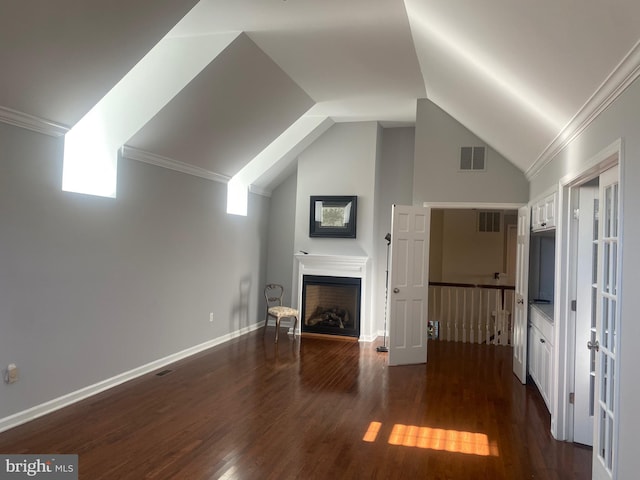 bonus room with lofted ceiling and dark hardwood / wood-style floors