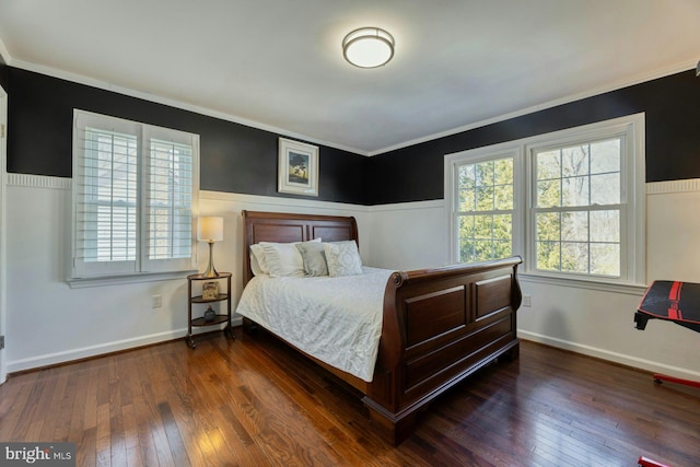 bedroom with multiple windows, crown molding, and dark wood-type flooring