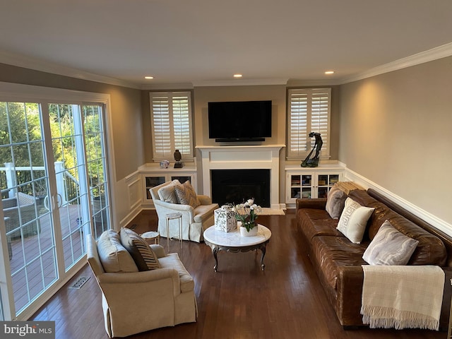 living room featuring ornamental molding and dark hardwood / wood-style floors