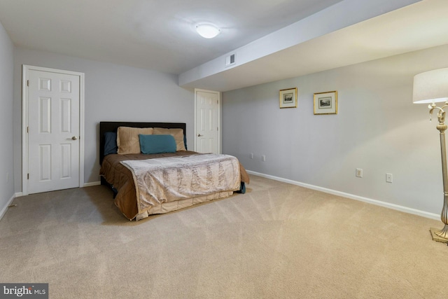 bedroom featuring light colored carpet