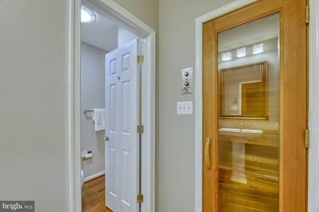 hallway with wood-type flooring