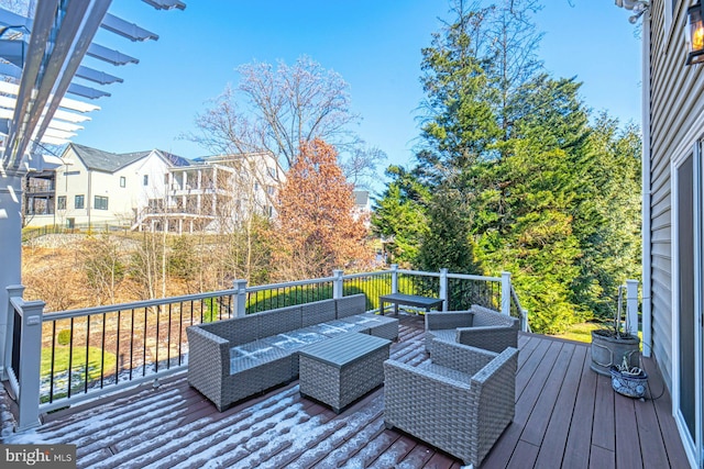 wooden deck featuring outdoor lounge area