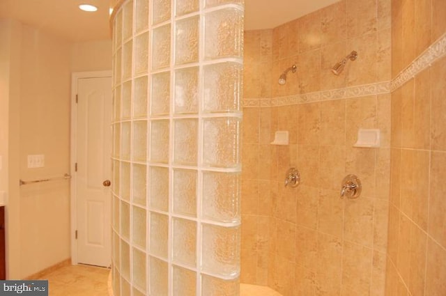 bathroom with tiled shower