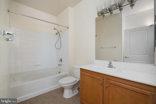 bathroom featuring toilet, vanity, washtub / shower combination, and tile patterned floors