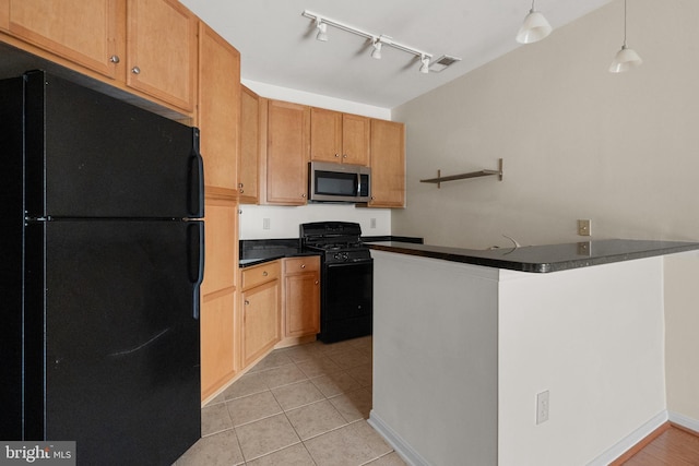 kitchen with light tile patterned flooring, a peninsula, hanging light fixtures, black appliances, and dark countertops