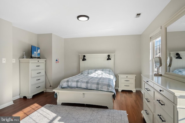 bedroom featuring dark hardwood / wood-style flooring