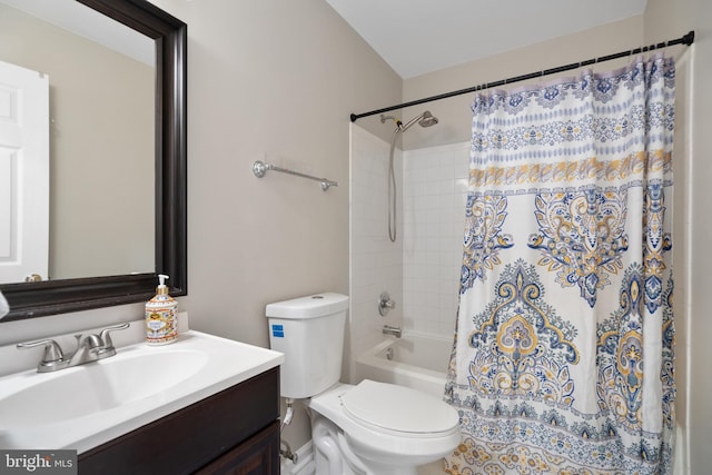 full bathroom with vanity, toilet, and shower / bath combo with shower curtain