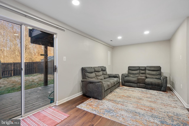 living room featuring dark wood-type flooring