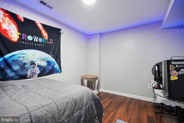 bedroom featuring dark wood-type flooring