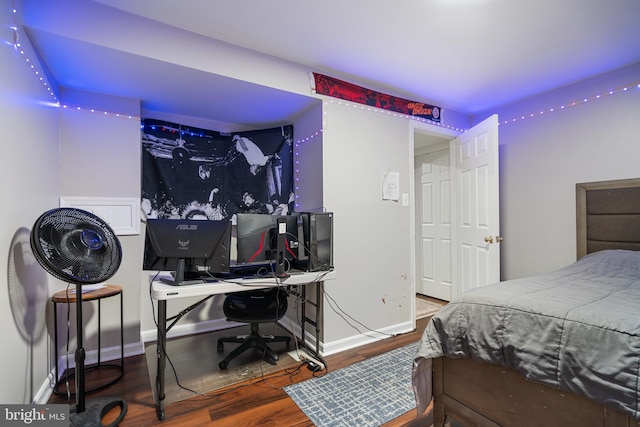 bedroom with wood-type flooring